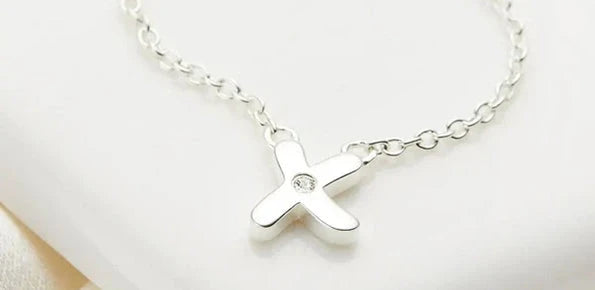 Silver kiss pendant
